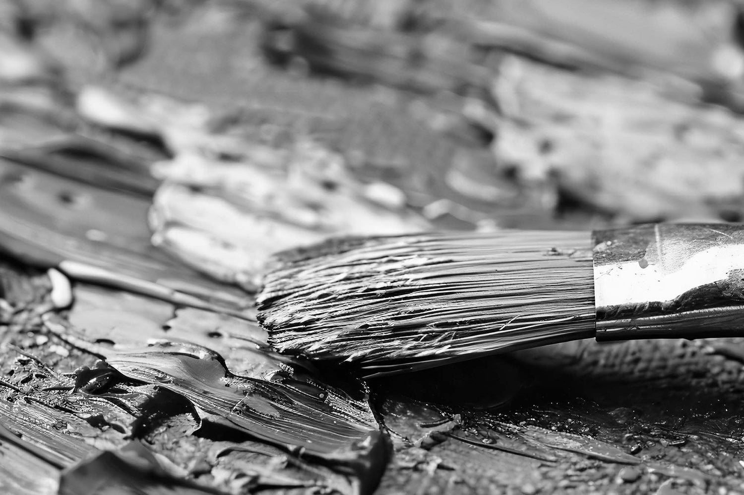 Close-up of a paintbrush with bristles on a textured surface